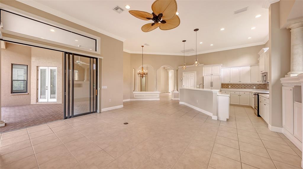 7134 Whitemarsh Circle Lakewood Ranch, FL 34202 - Photo 24 of 78 a view of an empty room and kitchen view