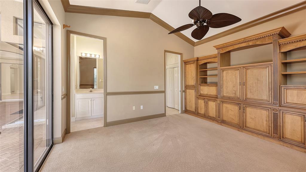 7134 Whitemarsh Circle Lakewood Ranch, FL 34202 - Photo 28 of 78 a view of empty room with cabinet and ceiling fan
