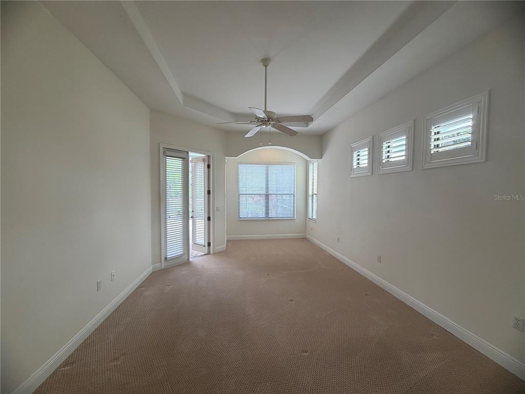 7134 Whitemarsh Circle Lakewood Ranch, FL 34202 - Photo 32 of 78 a view of a room with windows and chandelier
