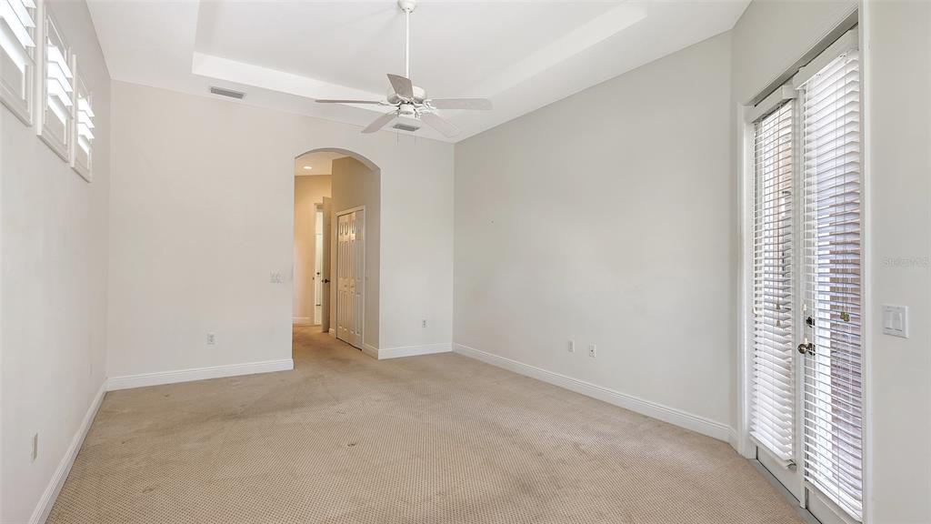 7134 Whitemarsh Circle Lakewood Ranch, FL 34202 - Photo 33 of 78 an empty room that has a chandelier fan and a window