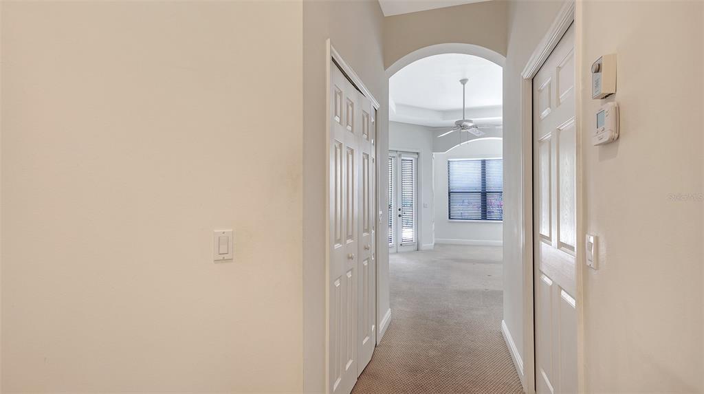 7134 Whitemarsh Circle Lakewood Ranch, FL 34202 - Photo 35 of 78 a view of a livingroom from a hallway