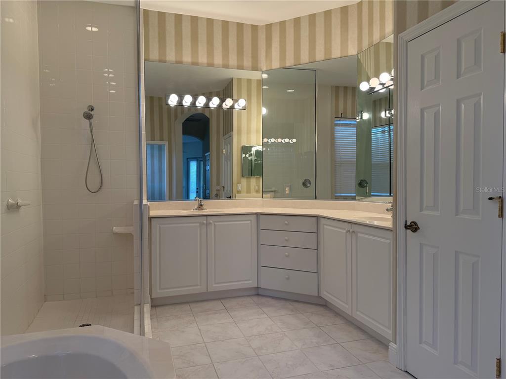 7134 Whitemarsh Circle Lakewood Ranch, FL 34202 - Photo 37 of 78 a bathroom with a double vanity sink and a mirror