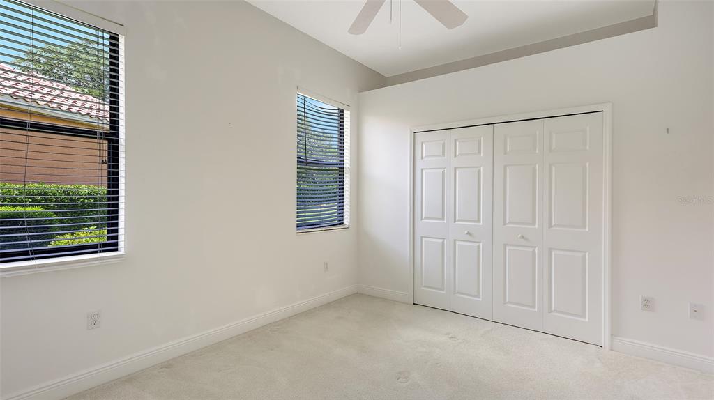 7134 Whitemarsh Circle Lakewood Ranch, FL 34202 - Photo 40 of 78 an empty room with windows