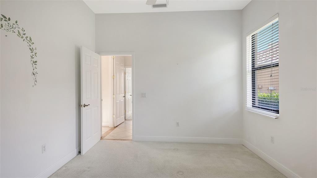 7134 Whitemarsh Circle Lakewood Ranch, FL 34202 - Photo 42 of 78 an empty room with windows