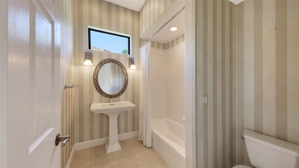 7134 Whitemarsh Circle Lakewood Ranch, FL 34202 - Photo 43 of 78 a bathroom with a toilet a sink and a mirror