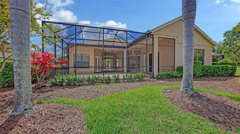 7134 Whitemarsh Circle Lakewood Ranch, FL 34202 - Photo 60 of 78 a front view of a house with garden