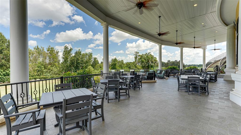 7134 Whitemarsh Circle Lakewood Ranch, FL 34202 - Photo 71 of 78 a view of a patio with chairs and a table