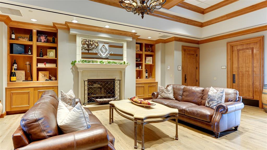 7134 Whitemarsh Circle Lakewood Ranch, FL 34202 - Photo 74 of 78 a living room with furniture and a fireplace