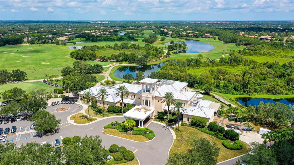 7134 Whitemarsh Circle Lakewood Ranch, FL 34202 - Photo 76 of 78 an aerial view of residential houses with outdoor space and lake view