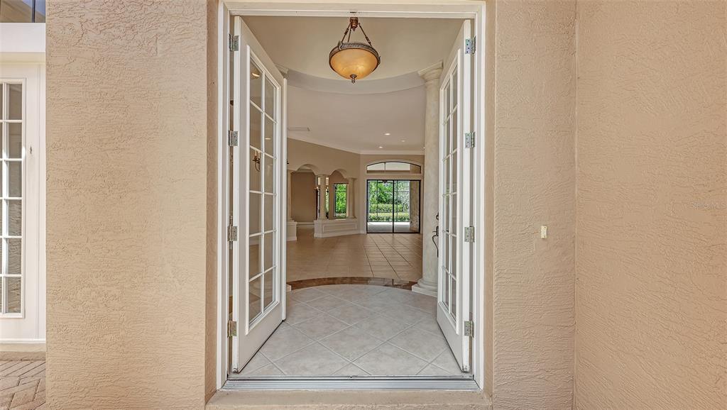 7134 Whitemarsh Circle Lakewood Ranch, FL 34202 - Photo 8 of 78 a view of a hallway with wooden floor