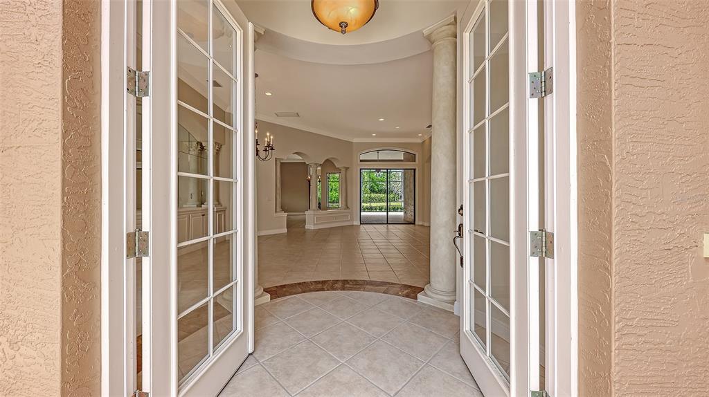 7134 Whitemarsh Circle Lakewood Ranch, FL 34202 - Photo 9 of 78 a view of entryway with bathroom and front door