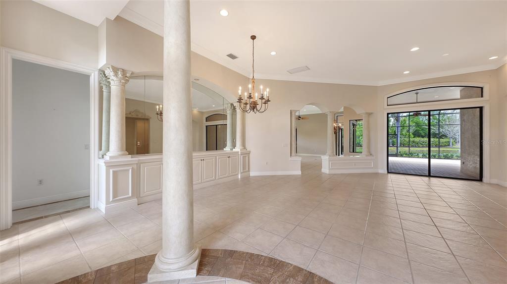 7134 Whitemarsh Circle Lakewood Ranch, FL 34202 - Photo 10 of 78 a view of a hallway with an entryway and an empty room
