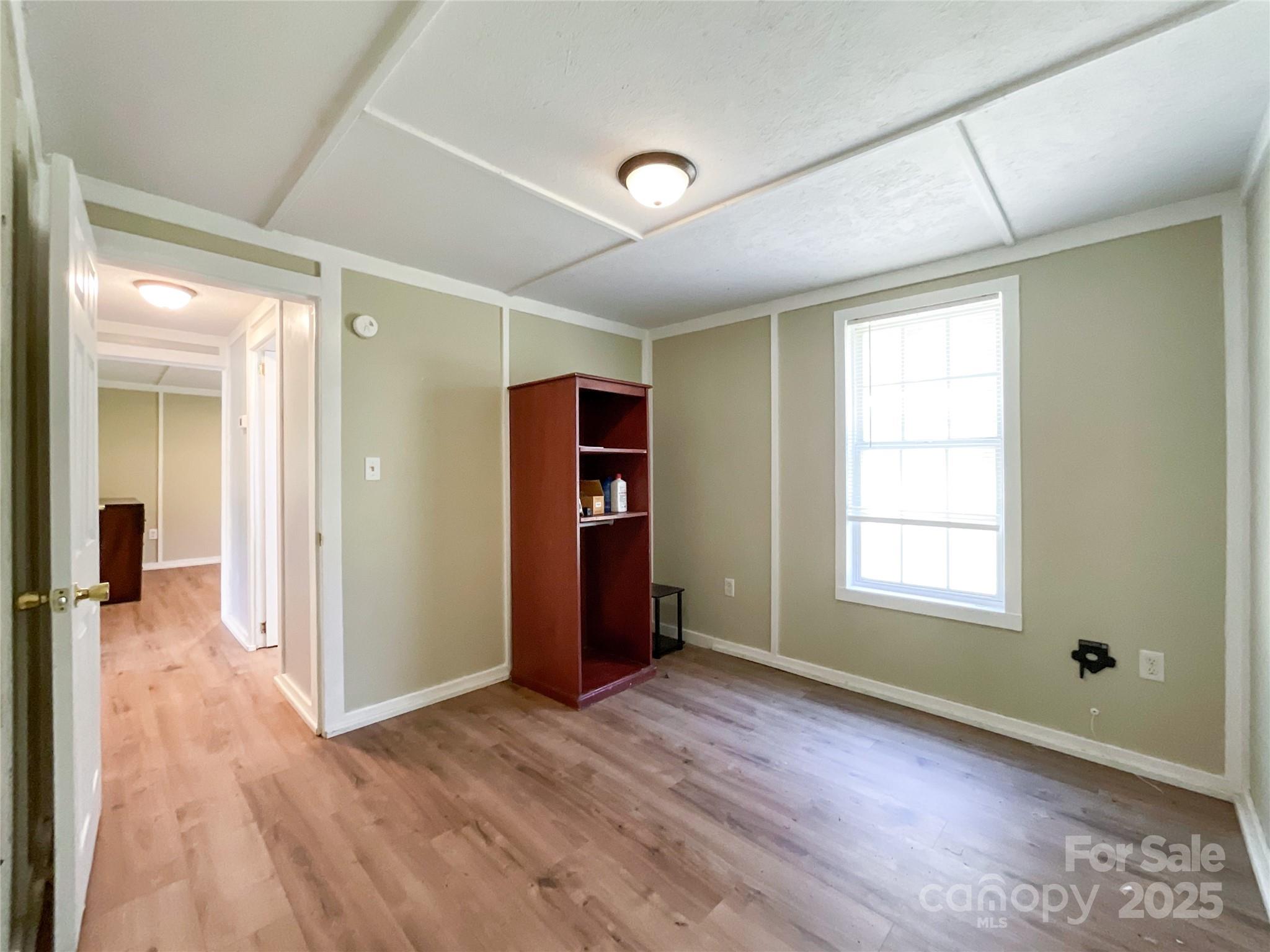 680 Mullinax Circle Blacksburg, SC 29702 - Photo 11 of 25 a view of empty room with wooden floor and fan