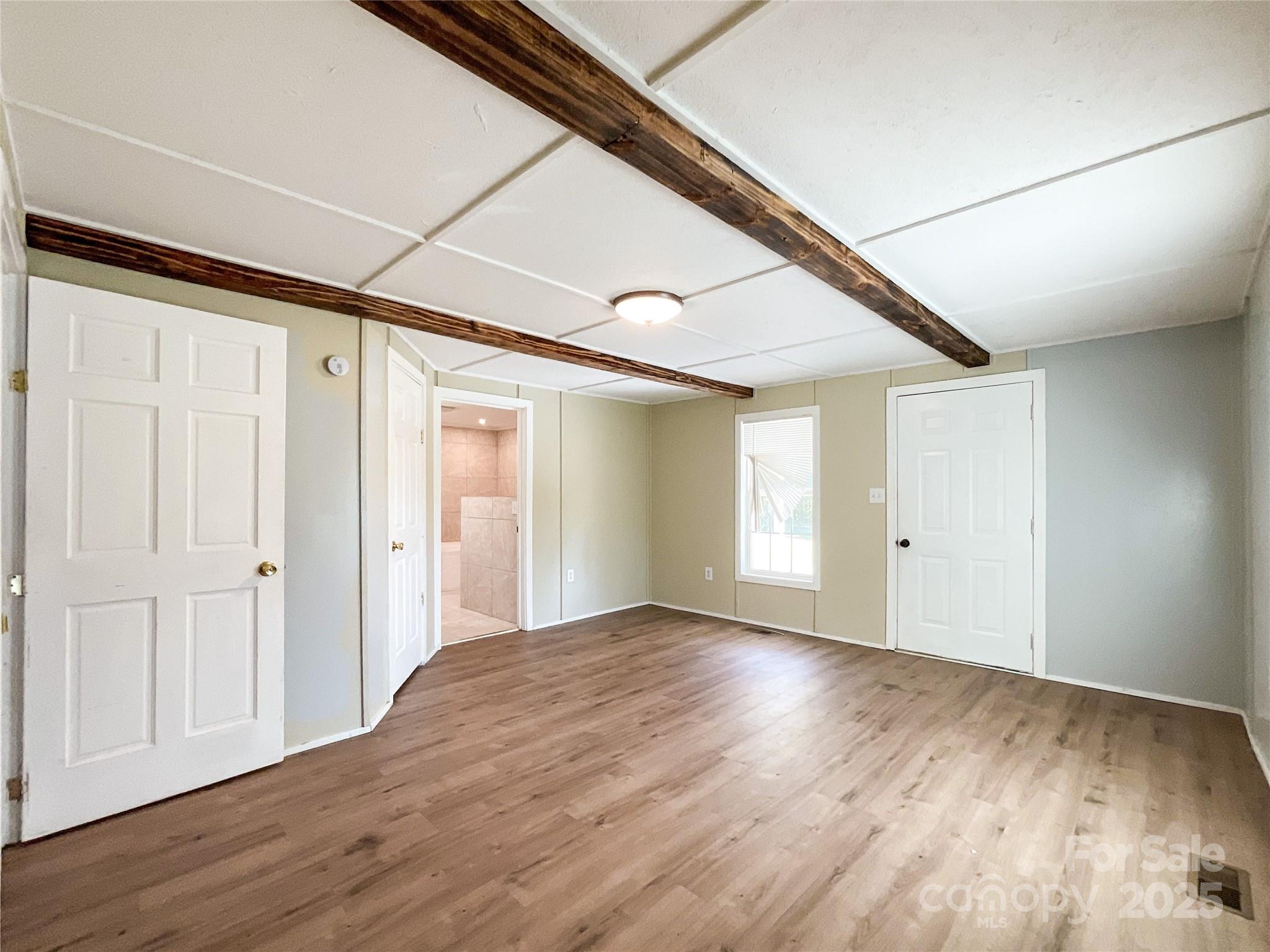 680 Mullinax Circle Blacksburg, SC 29702 - Photo 13 of 25 a view of an empty room with wooden floor