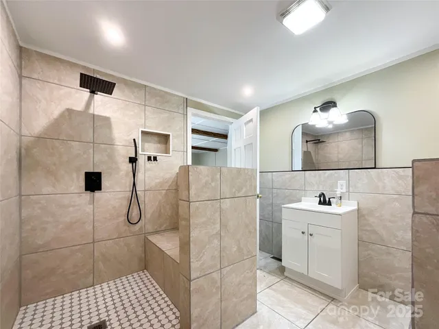 a bathroom with a sink and mirror