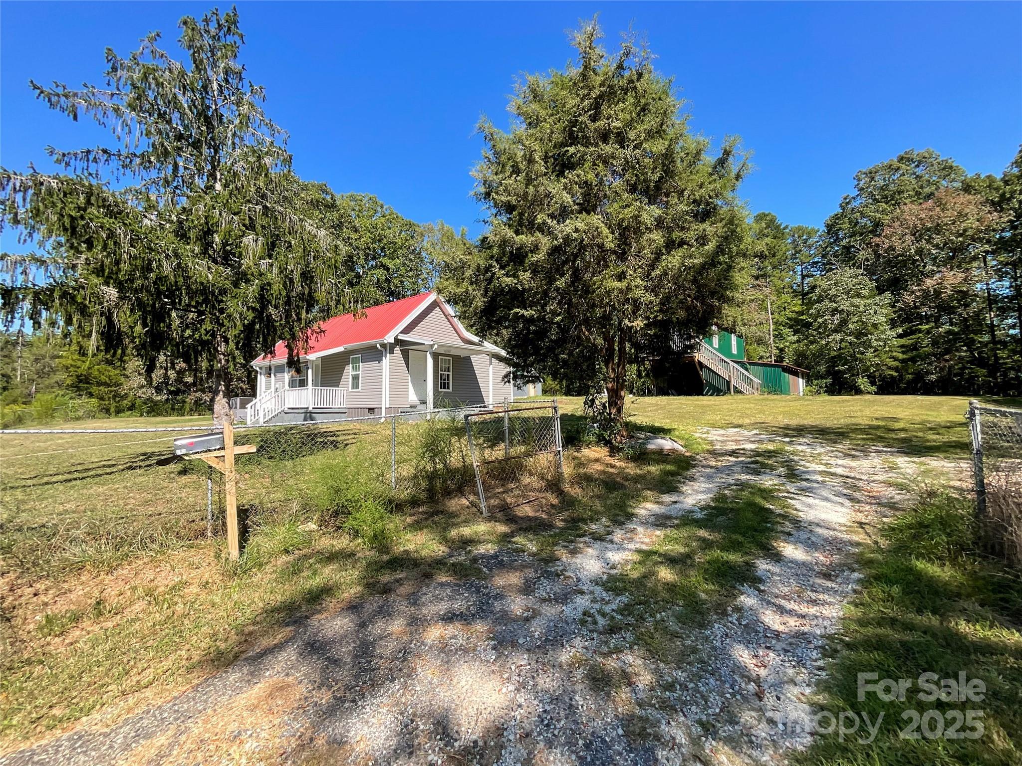 680 Mullinax Circle Blacksburg, SC 29702 - Photo 2 of 25 a backyard of a house with lots of green space