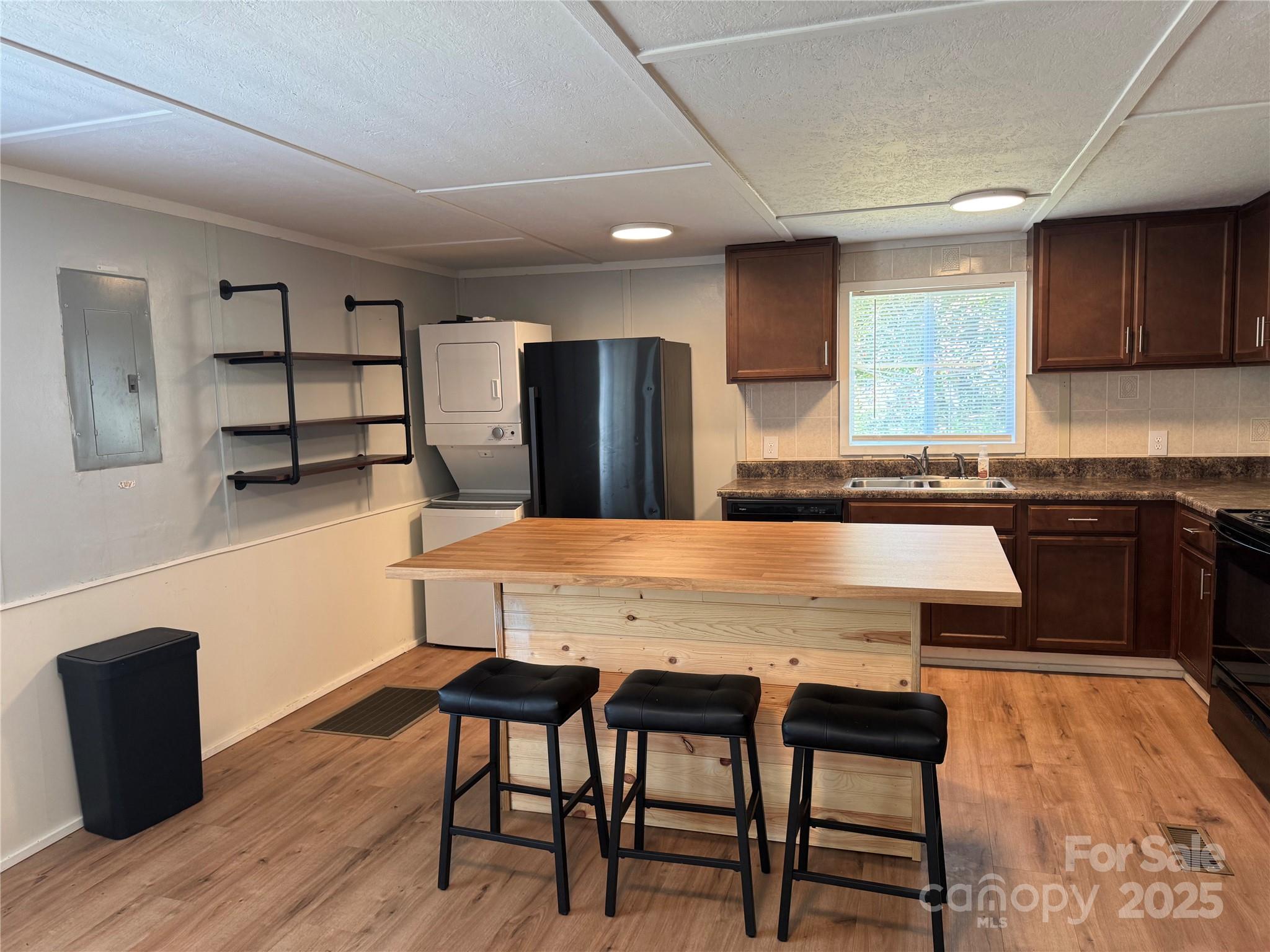 680 Mullinax Circle Blacksburg, SC 29702 - Photo 4 of 25 a kitchen with stainless steel appliances granite countertop a table chairs sink and cabinets