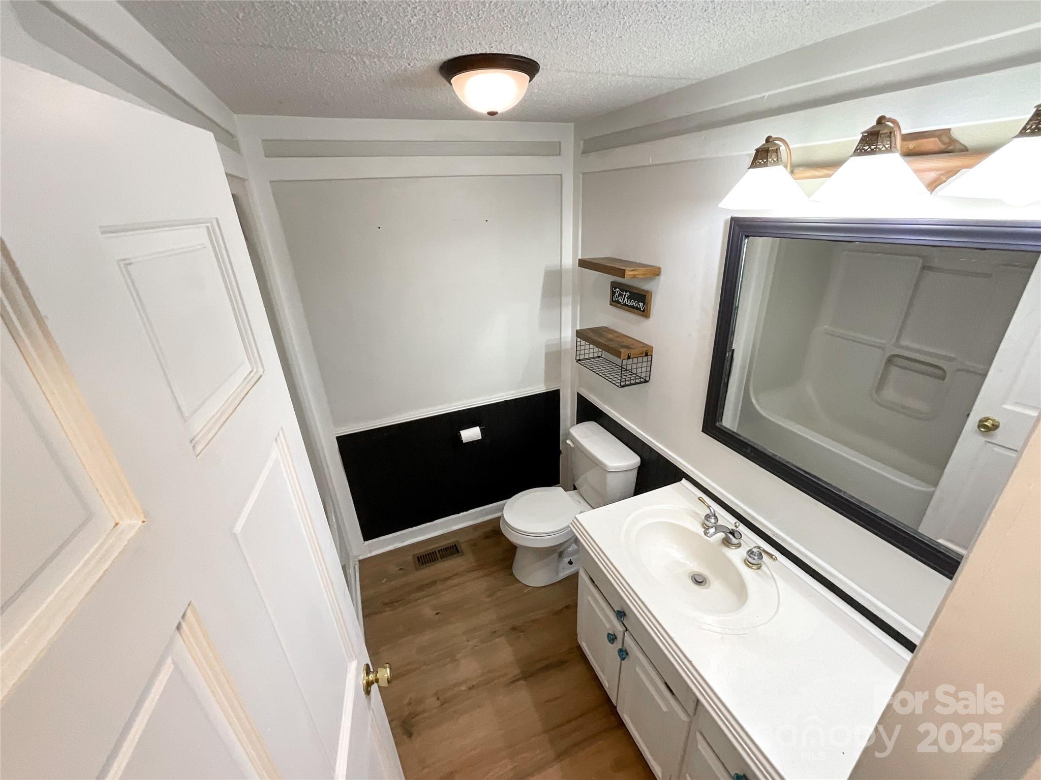 680 Mullinax Circle Blacksburg, SC 29702 - Photo 8 of 25 a bathroom with a sink and mirror