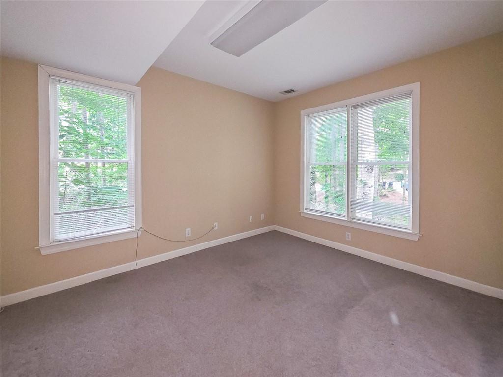 3712 Frederica Road Northwest Berkeley Lake, GA 30096 - Photo 37 of 49 an empty room with windows