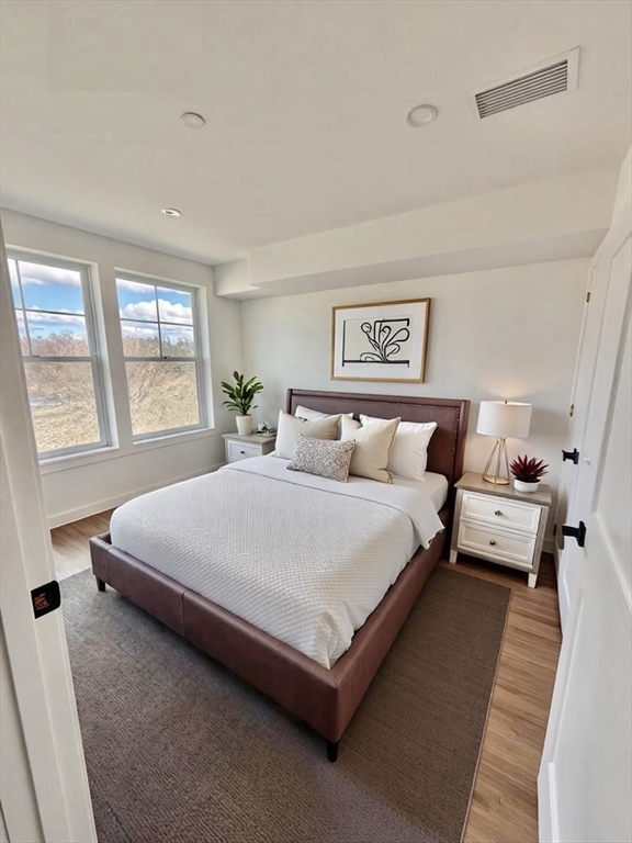 26 Union Street, Unit 115 Natick, MA 01760 - Photo 3 of 7 a bedroom with bed and window