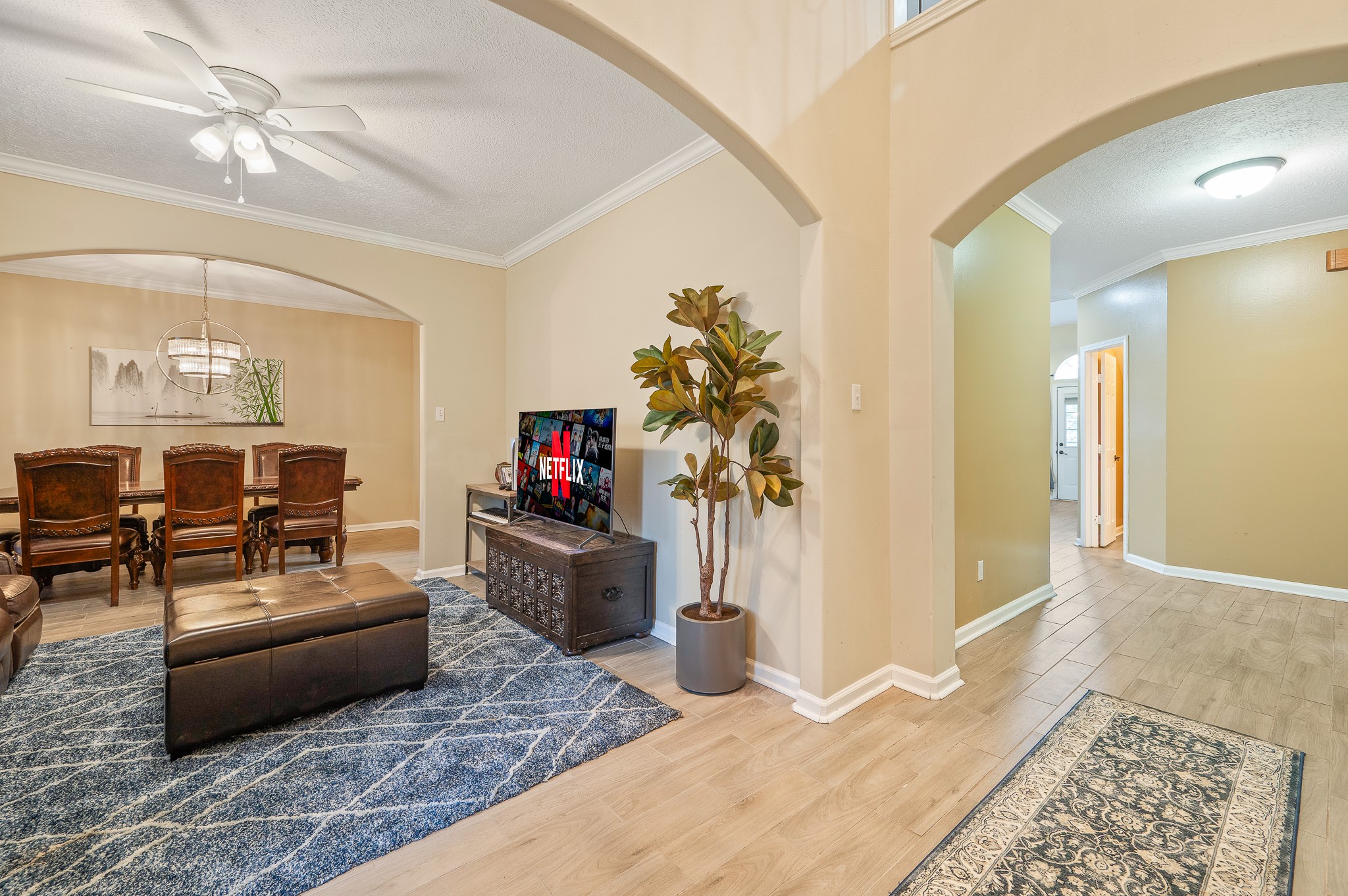 8111 Morningbrook Court Spring, TX 77379 - Photo 6 of 46 a living room with furniture and a flat screen tv