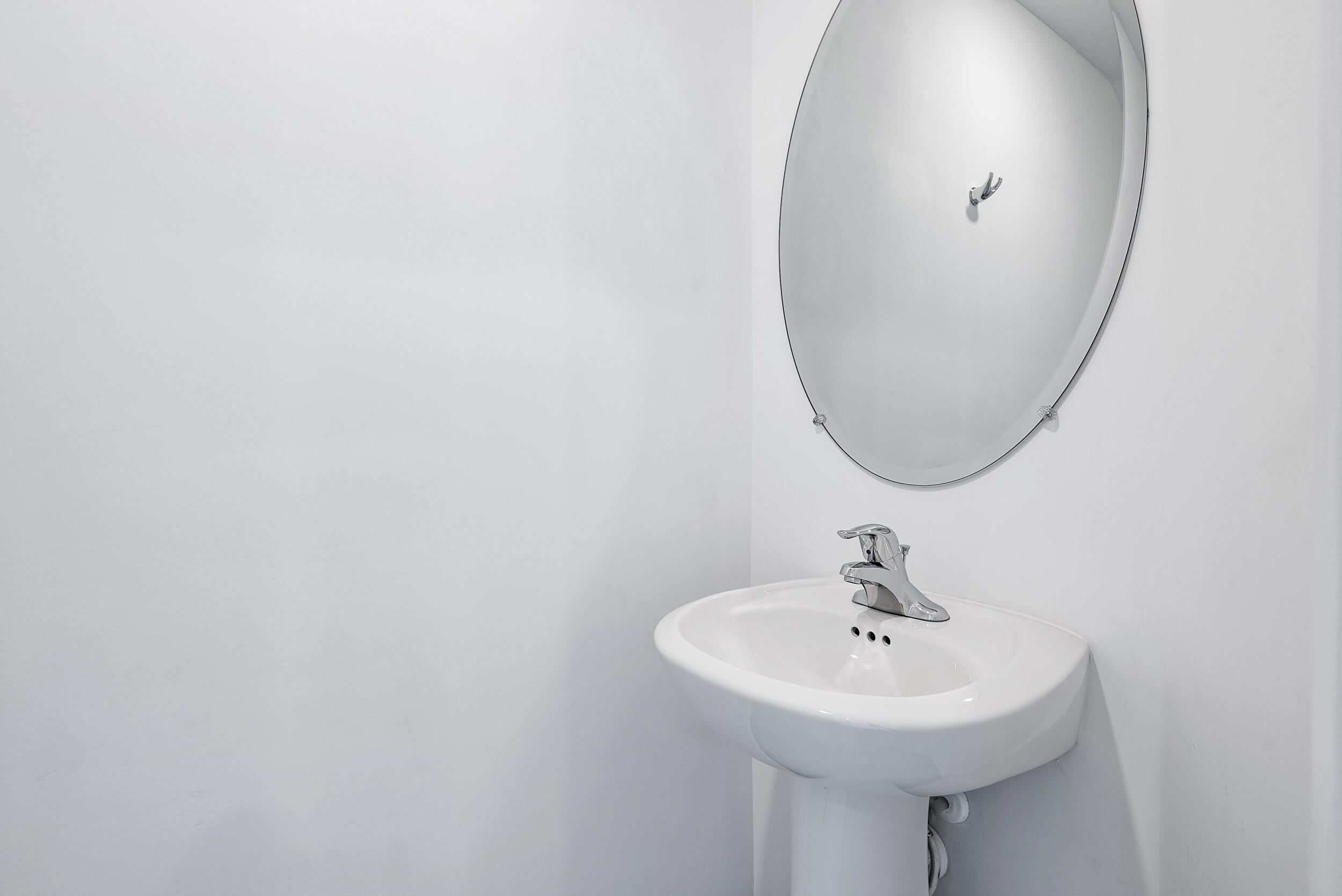 4215 Bent River Road Lake Worth, FL 33467 - Photo 14 of 29 a bathroom with a sink and a mirror