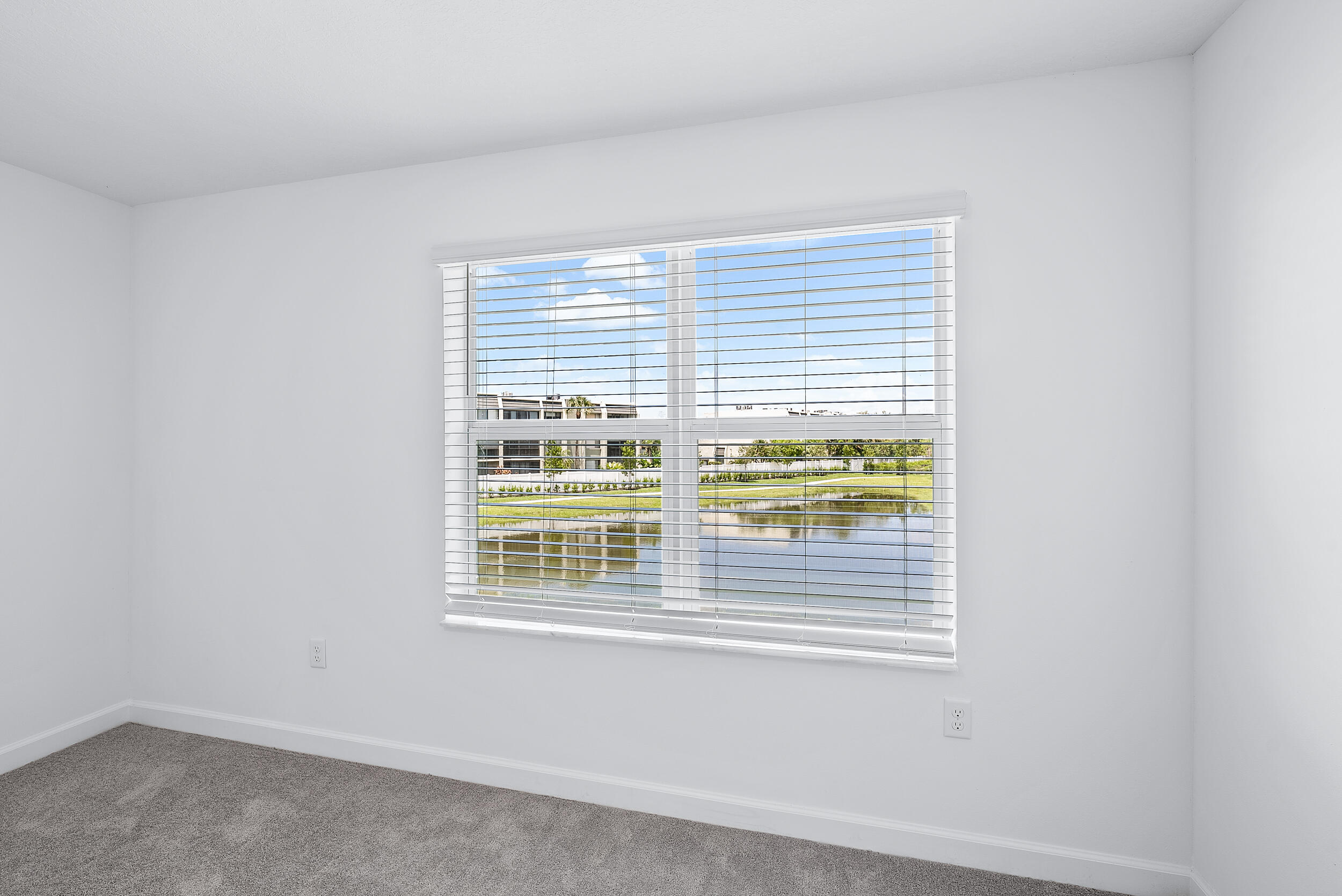 4215 Bent River Road Lake Worth, FL 33467 - Photo 16 of 29 a view of an empty room with a window