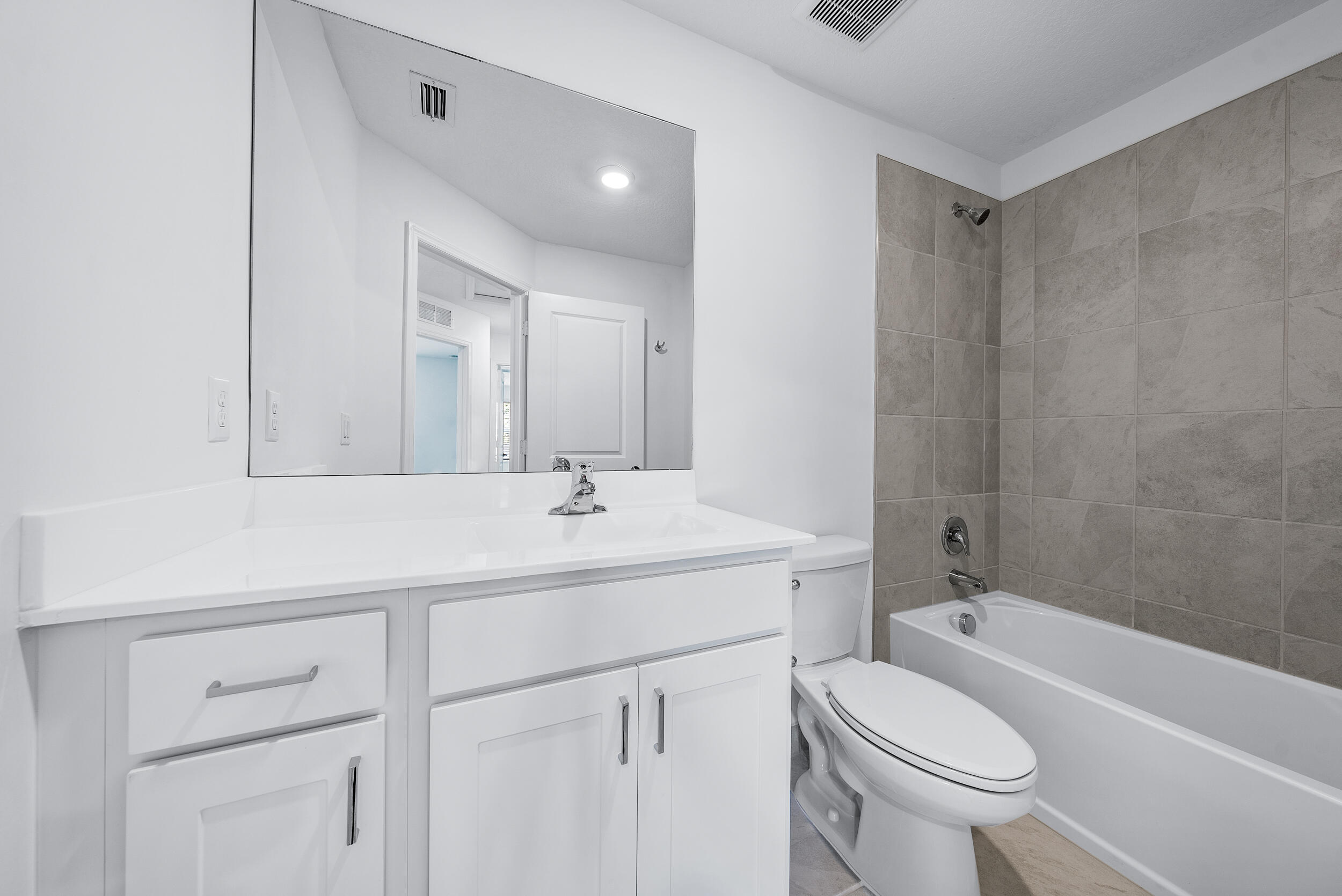 4215 Bent River Road Lake Worth, FL 33467 - Photo 21 of 29 a bathroom with a sink a toilet and a bathtub