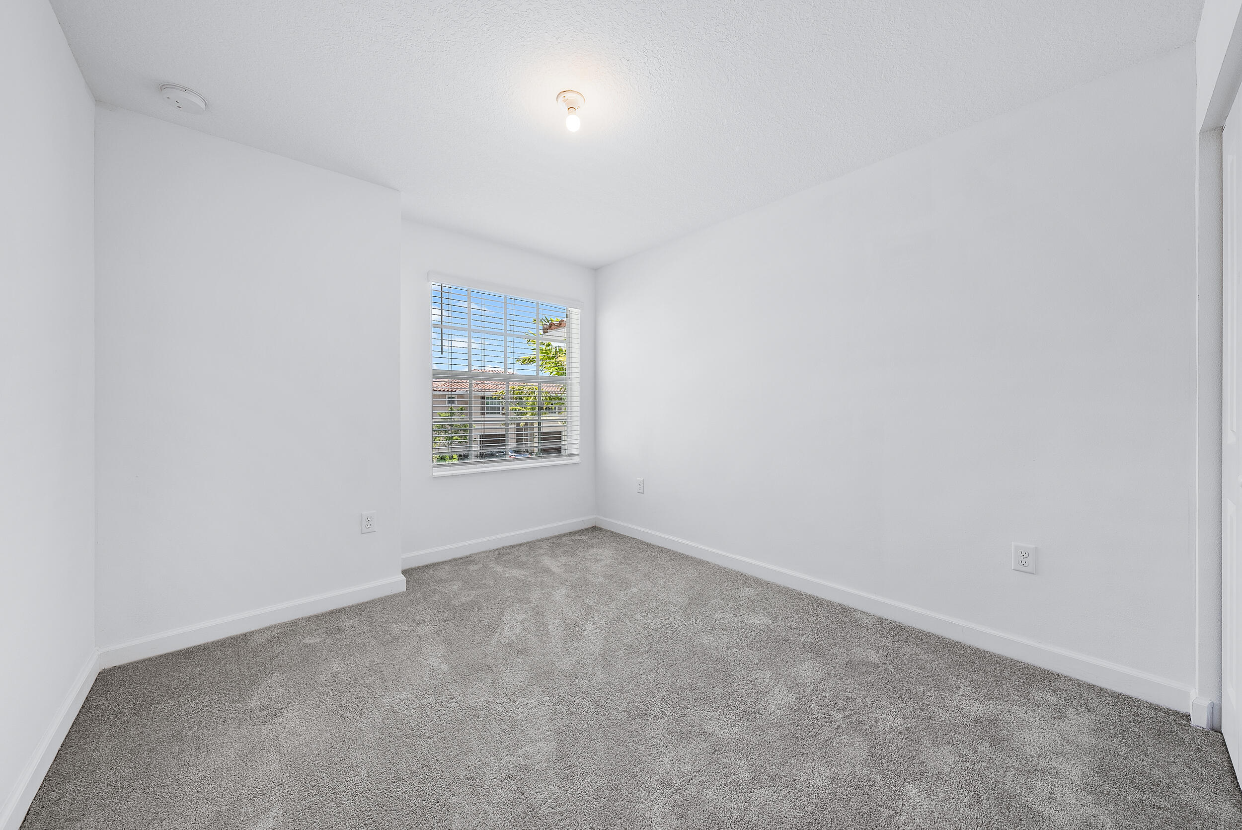 4215 Bent River Road Lake Worth, FL 33467 - Photo 22 of 29 an empty room with windows