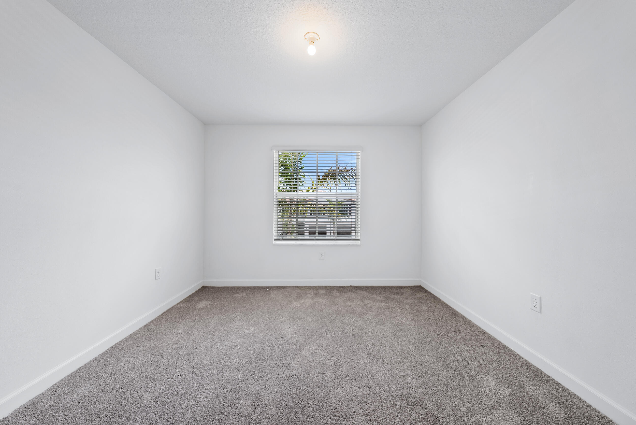 4215 Bent River Road Lake Worth, FL 33467 - Photo 23 of 29 an empty room with a window