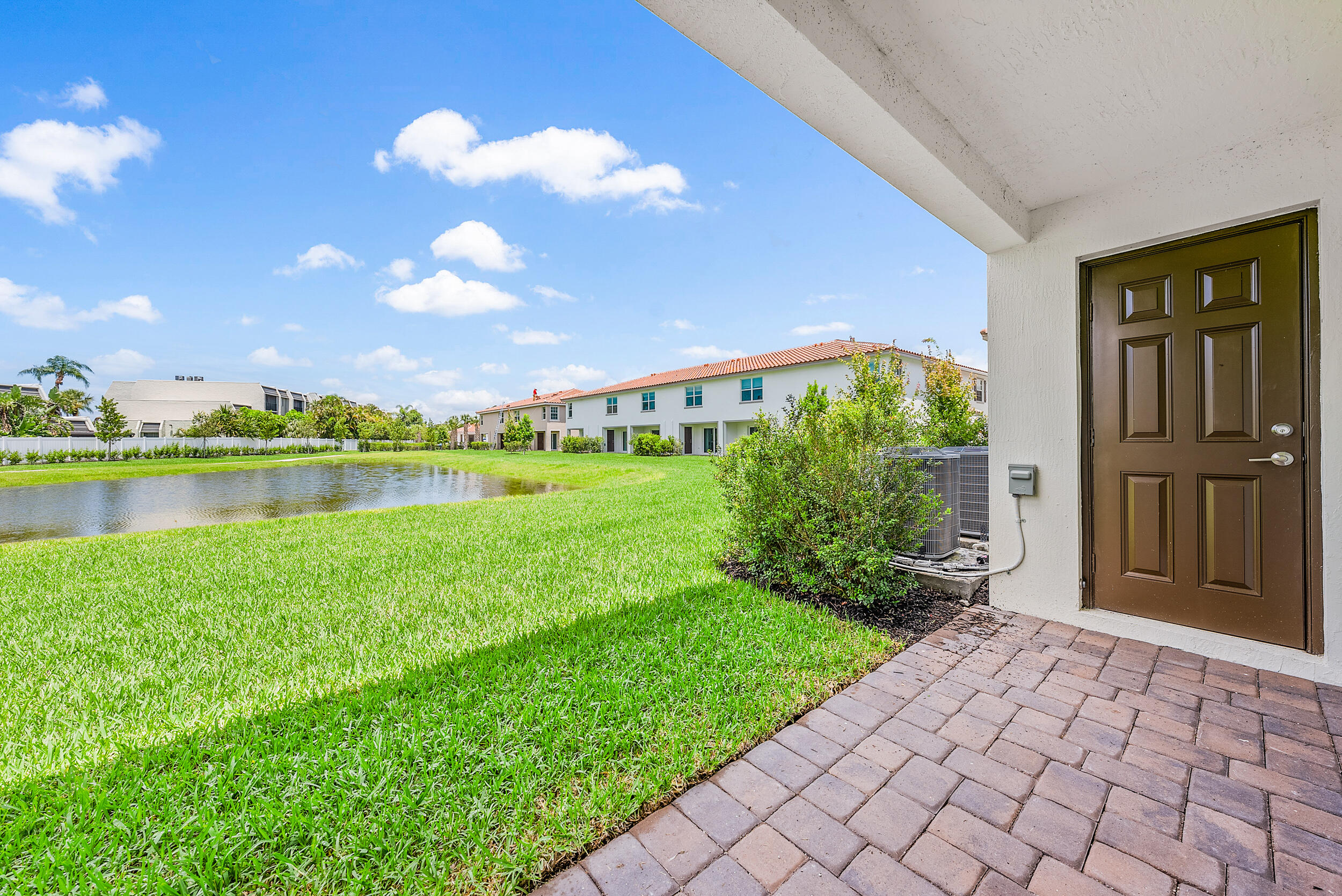 4215 Bent River Road Lake Worth, FL 33467 - Photo 26 of 29 a view of a garden with a lake