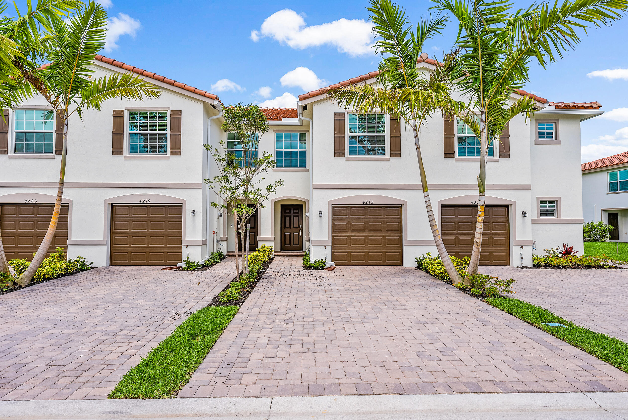 4215 Bent River Road Lake Worth, FL 33467 - Photo 29 of 29 a front view of a house with a yard and garage