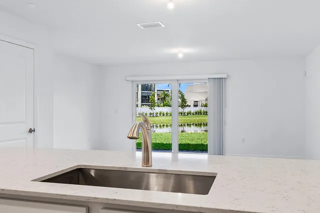 a kitchen with a sink and a window