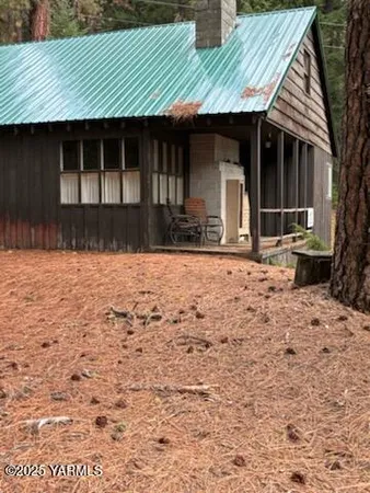 a view of house with backyard of house