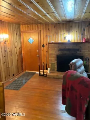 a blue bed sitting in a room next to a window