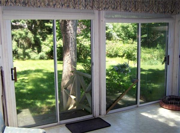48 Signal Hill Road Marshfield, MA 02050 - Photo 3 of 11 a view of a glass door and garden