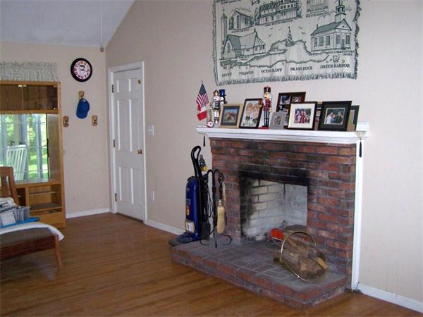 48 Signal Hill Road Marshfield, MA 02050 - Photo 8 of 11 a living room with furniture and a fireplace