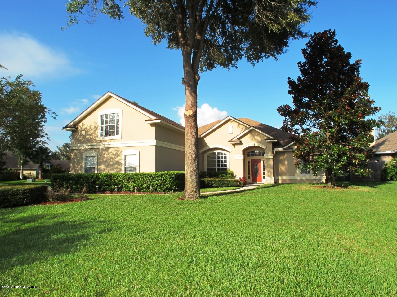 1645 Margarets Walk Road Fleming Island, FL 32003 - Photo 1 of 42 a front view of a house with a yard and garage