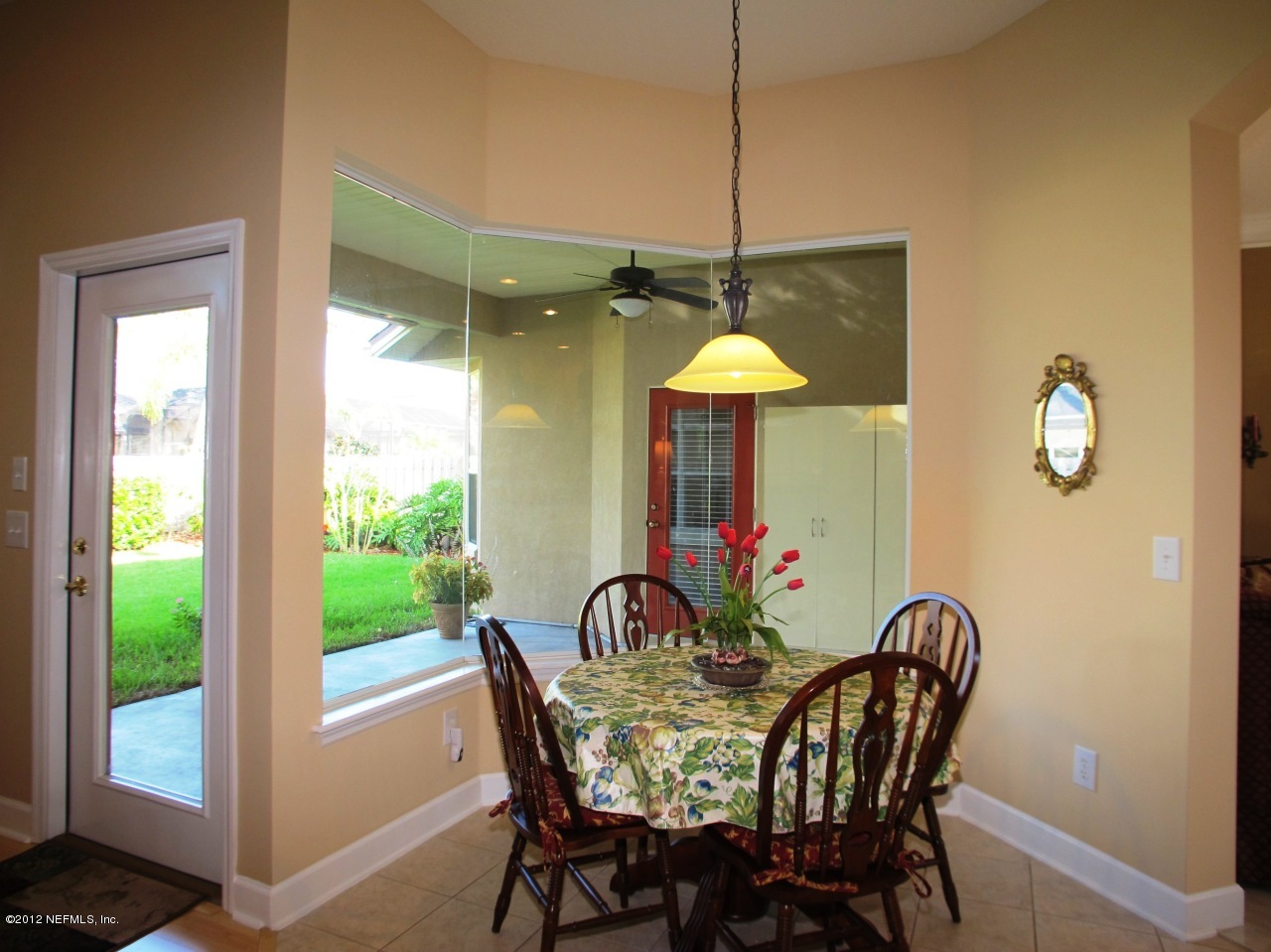 1645 Margarets Walk Road Fleming Island, FL 32003 - Photo 13 of 42 a view of a dining room with furniture window and outside view