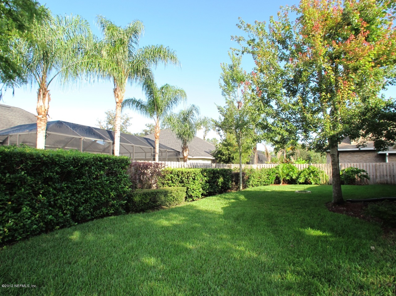 1645 Margarets Walk Road Fleming Island, FL 32003 - Photo 26 of 42 a view of a backyard with a garden