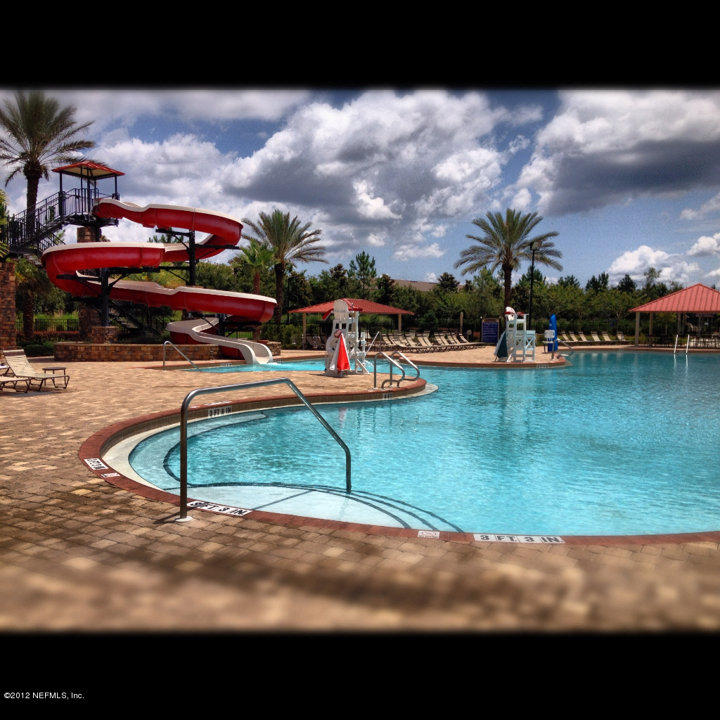 1645 Margarets Walk Road Fleming Island, FL 32003 - Photo 34 of 42 a view of a swimming pool with lawn chairs