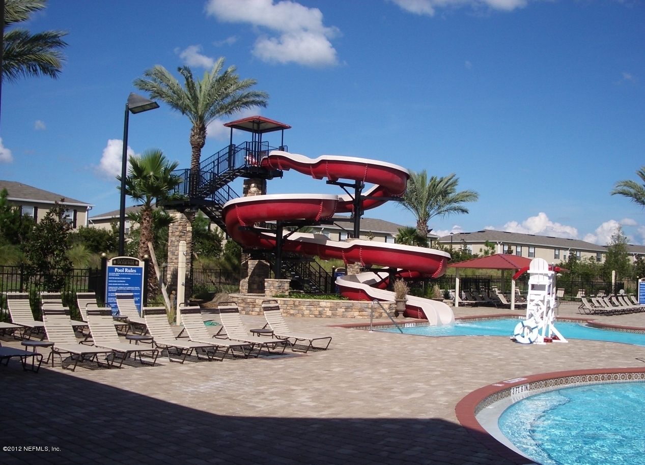 1645 Margarets Walk Road Fleming Island, FL 32003 - Photo 35 of 42 a view of a cafe with a table and chairs under an umbrella