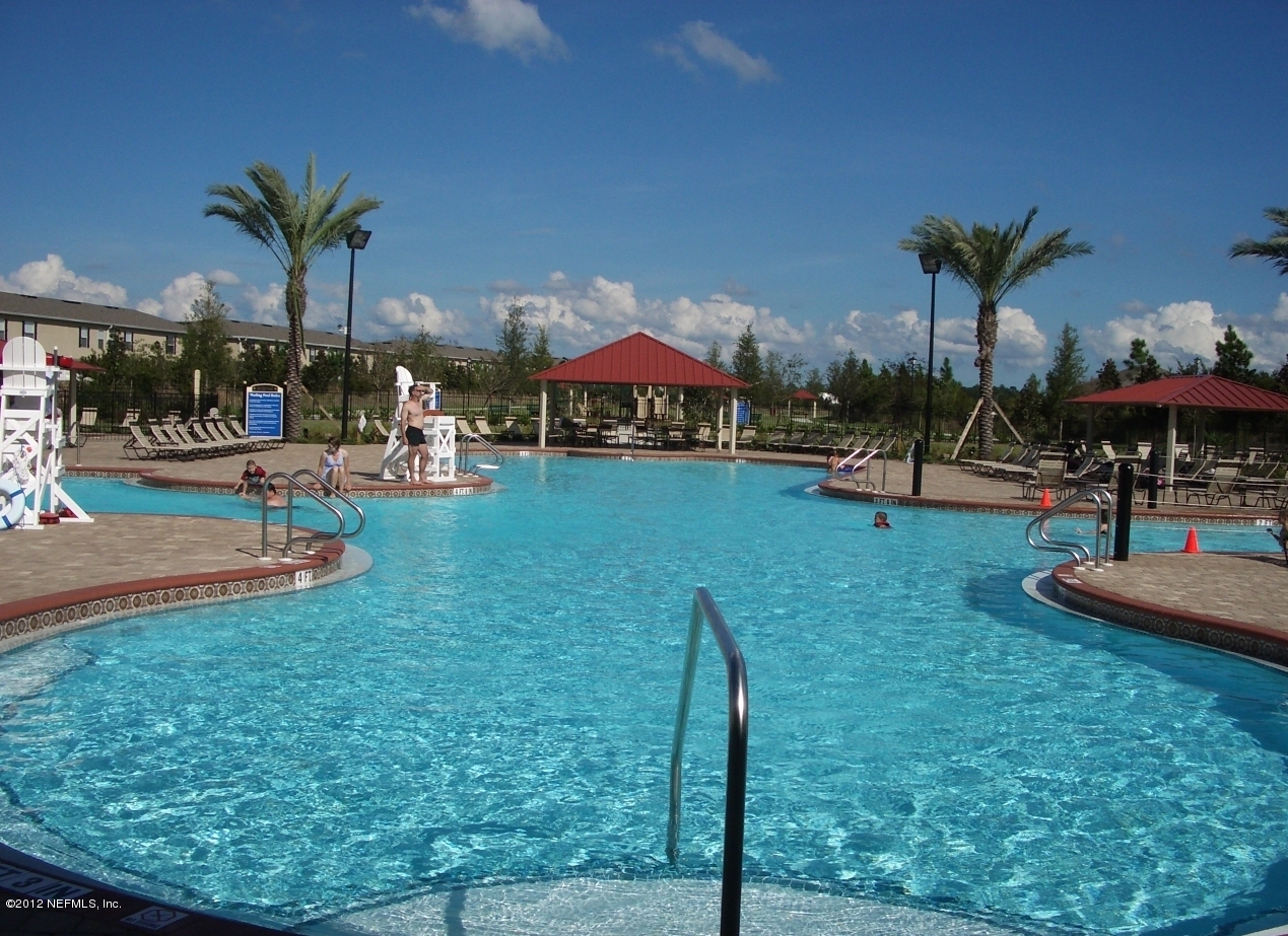 1645 Margarets Walk Road Fleming Island, FL 32003 - Photo 36 of 42 a view of a backyard with plants and patio