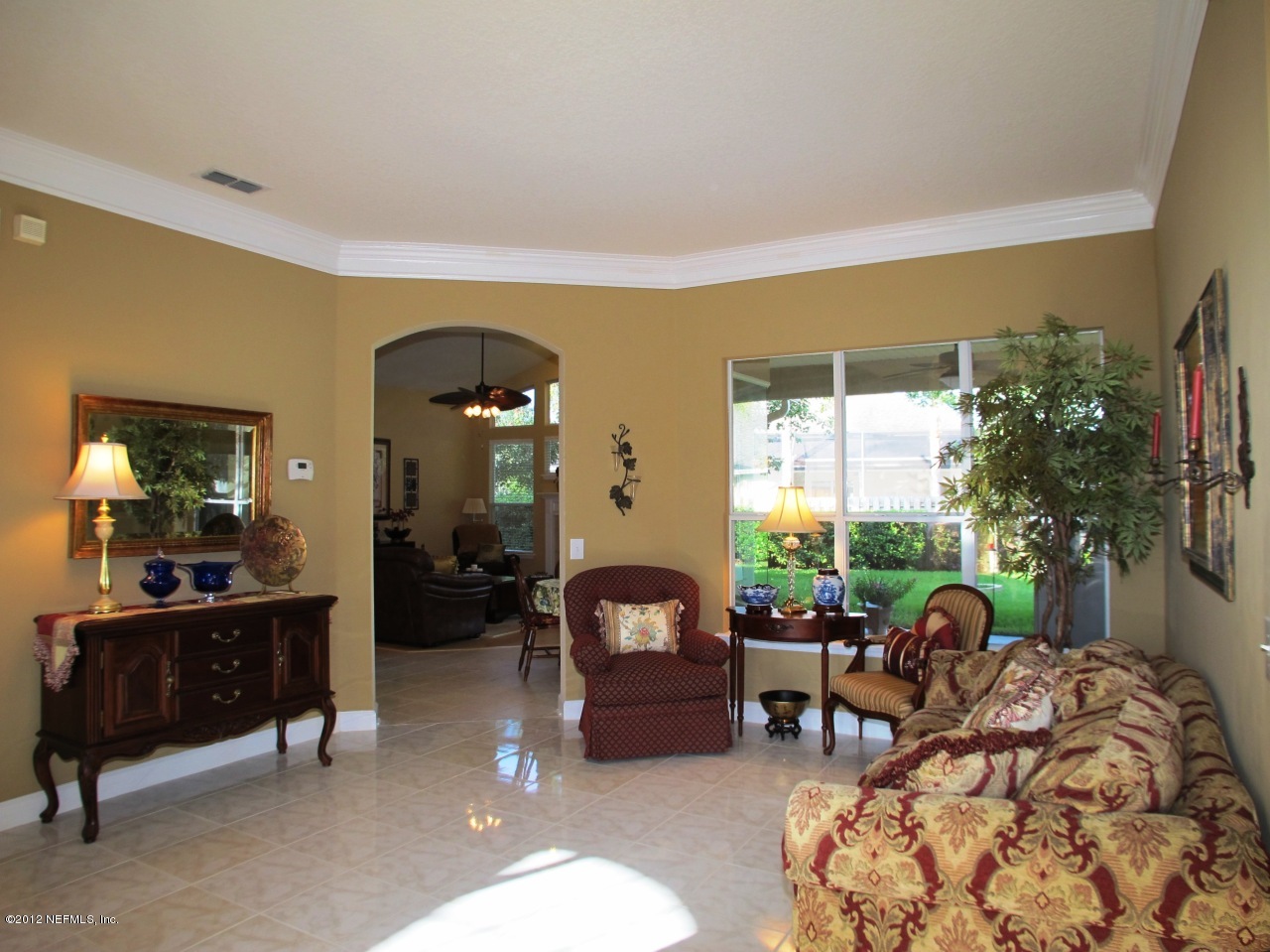 1645 Margarets Walk Road Fleming Island, FL 32003 - Photo 4 of 42 a living room with furniture and a large window