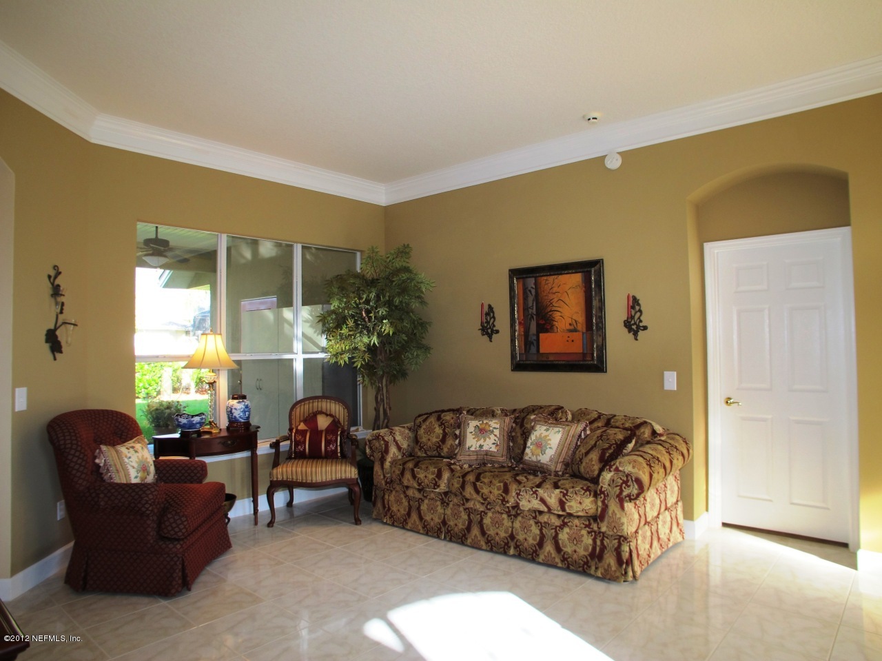 1645 Margarets Walk Road Fleming Island, FL 32003 - Photo 5 of 42 a spacious bedroom with a bed and a couch
