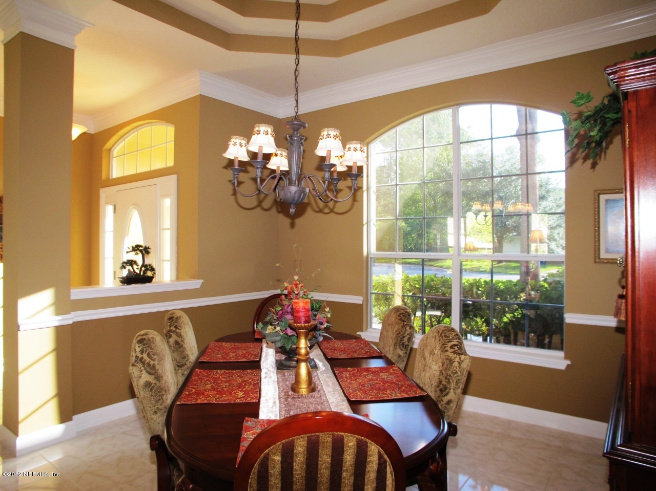 1645 Margarets Walk Road Fleming Island, FL 32003 - Photo 7 of 42 a view of a dining room with furniture wooden floor and chandelier