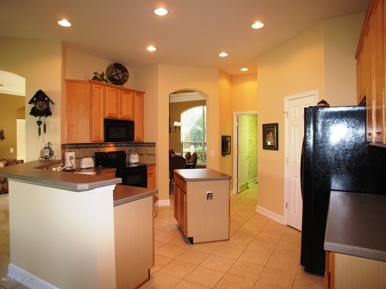 1645 Margarets Walk Road Fleming Island, FL 32003 - Photo 10 of 42 a kitchen with stainless steel appliances granite countertop a refrigerator and a sink