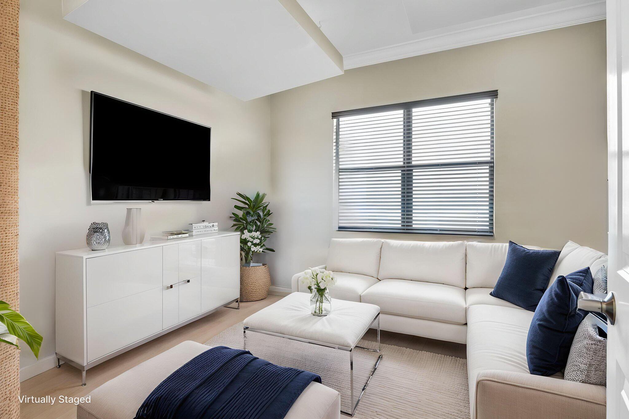 9577 Eden Roc Court Delray Beach, FL 33446 - Photo 15 of 53 a living room with furniture and a flat screen tv