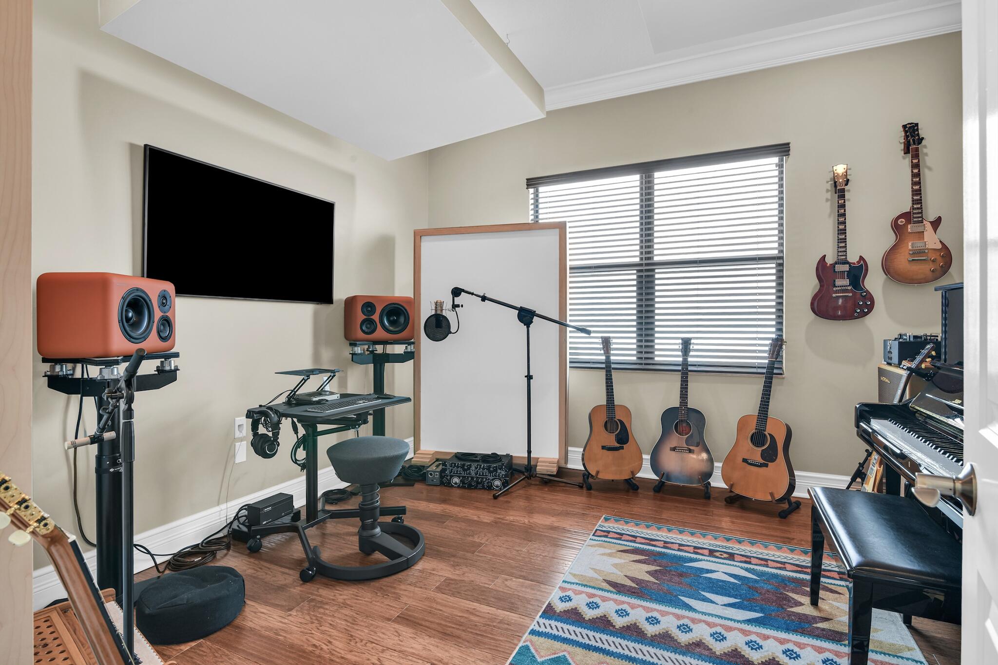 9577 Eden Roc Court Delray Beach, FL 33446 - Photo 16 of 53 a living room with furniture a flat screen tv and a window