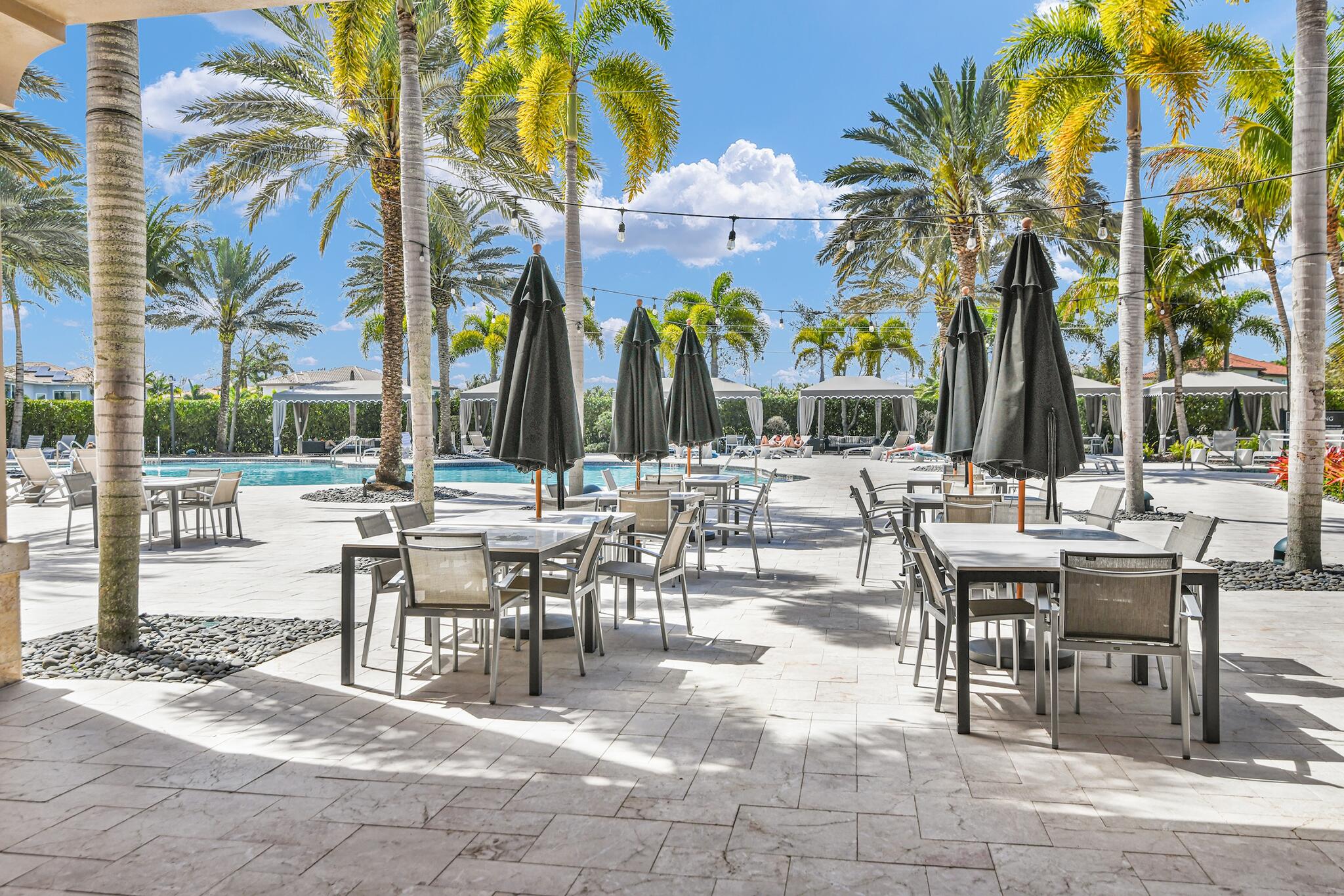 9577 Eden Roc Court Delray Beach, FL 33446 - Photo 32 of 53 Poolside Tables at Seven Bridges
